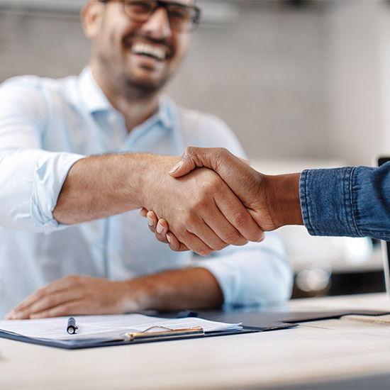 Man shaking hands in interview